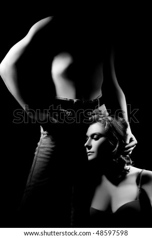 Erotic passion sexual couple isolated on black background Man
