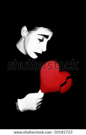 Sad mime broken heart. Unhappy performer in sorrow dramatic black and white make-up