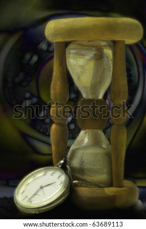 Hourglass and clock. Night time concept still-life