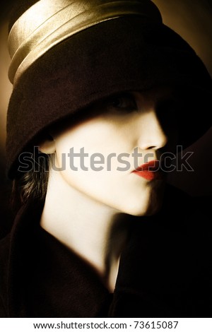 Woman face in black hat. Artistic portrait of beautiful woman in black hat