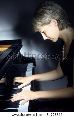 Piano music playing pianist musician. Musical instrument grand piano with beautiful woman performer.