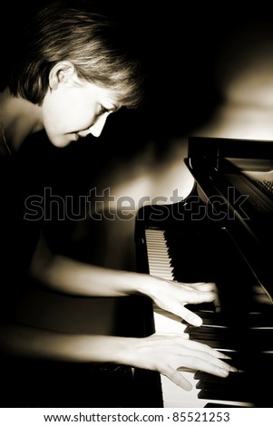 Pianist musician piano music playing. Musical instrument grand piano with beautiful woman performer.
