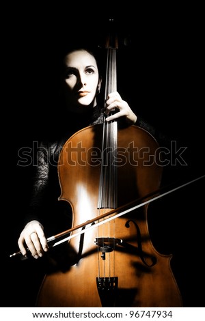 Cello classical musician cellist performer. Woman with musical instrument on black background