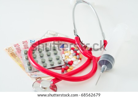 Pills, money and a stethoscope against white background.