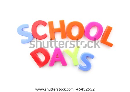 The words \'school days\' spelled out using colored fridge magnets, isolated on white