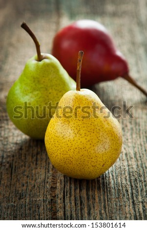 Fresh pears on old wooden table