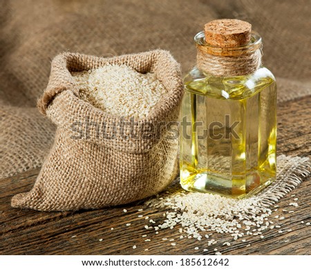 Sesame oil and sesame seeds in small bag