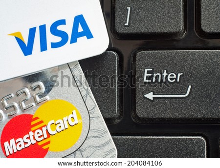 GDANSK, POLAND - 10 JULY 2014. Shopping on the Internet - Visa card and Mastercard  on the notebook keyboard.