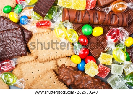 Food concept - candy, chocolate, candy bars, jelly