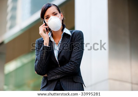 A beautiful businesswoman wearing a mask to represent the tough economic and world times