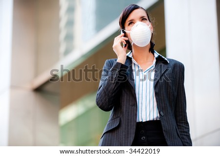 A beautiful businesswoman wearing a mask to represent the tough economic and world times