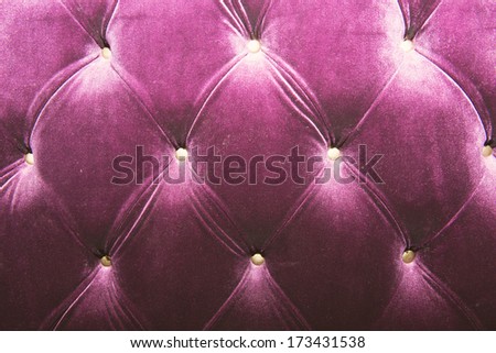 Luxury purple velvet cushion close-up background