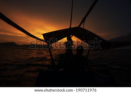 Diving boat and sunset.