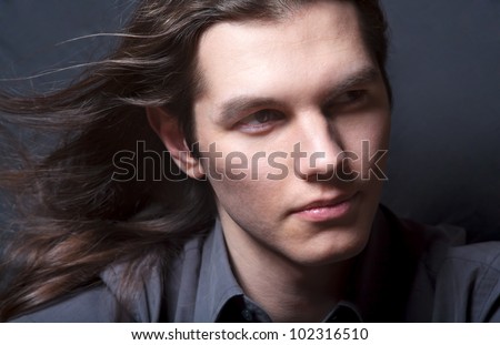 Handsome young long haired male model