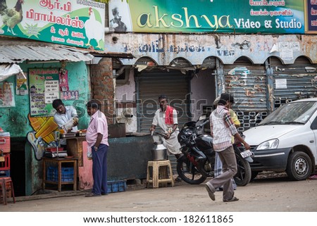 MADURAI, INDIA-FEBRUARY 15: Trader on the street of Indian town on February 15, 2013 in Madurai, India. Trader on a city street province Tamil Nadu