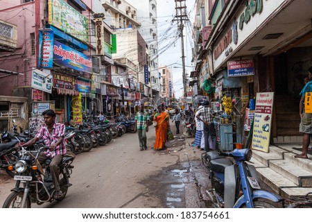 MADURAI, INDIA-FEBRUARY 15: Street of Indian city 15, 2013 in Madurai, India. People on the street of indian town