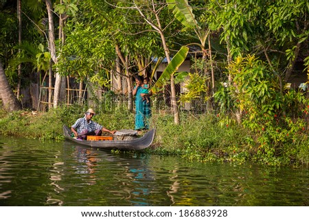 KOCHIN, INDIA-FEBRUARY 23: Hindu on the boat on February 23, 2013 in Kochin, India. Hindu man go by boat suburb of Cochin