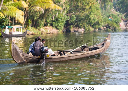 KOCHIN, INDIA-FEBRUARY 24: Hindu on the boat on February 24, 2013 in Kochin, India. Hindu man go by boat suburb of Cochin