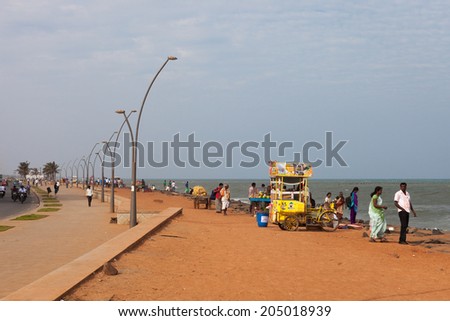 PONDICHERRY, INDIA-FEBRUARY 12: Waterfront of Indian city 12, 2013 in Pondicherry, India. People on the waterfront of indian town