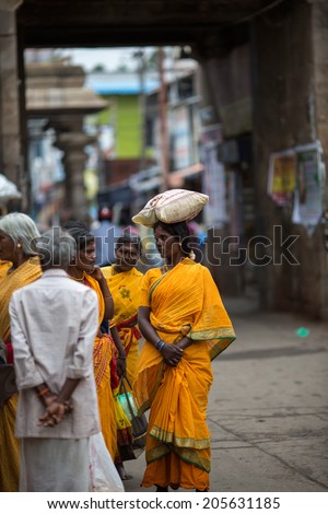 TRICHY, INDIA-FEBRUARY 14: Street of Indian city 14, 2013 in Trichy, India. Women on the street of indian town