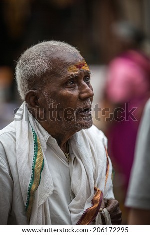 TRICHY, INDIA-FEBRUARY 14: Indian old man feb 14, 2013 in Trichy, India. The old man on the street of Indian town.