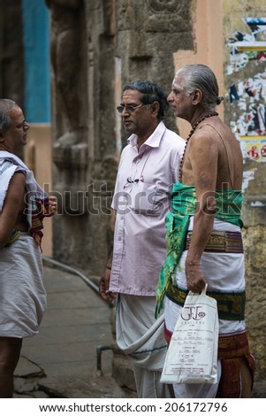 TRICHY, INDIA-FEBRUARY 15: Indian men feb 15, 2013 in Trichy, India. Group of Indians in the temple.