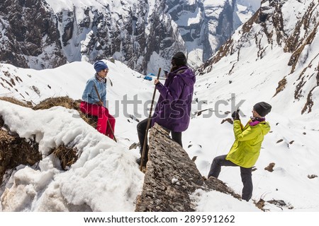 NARCHYANG, NEPAL-MARCH 23: A group of tourists 23, 2015 in Narchyang, Nepal. A group of tourists on a route to the Annapurna  base camp.