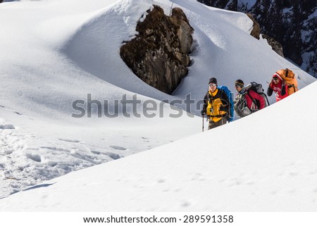 NARCHYANG, NEPAL-MARCH 23: A group of tourists 23, 2015 in Narchyang, Nepal. A group of tourists on a route to the Annapurna  base camp.