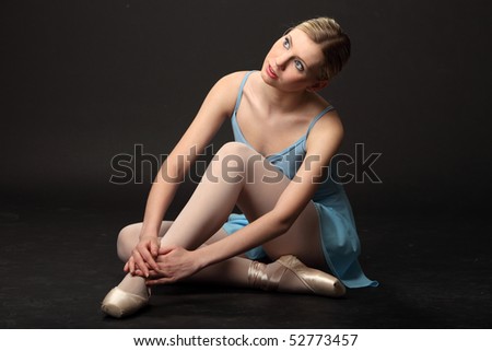 Ballerina sitting on the floor