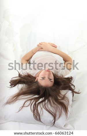 Young woman sleep in a bed