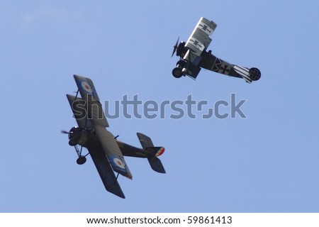 PARDUBICE,CZECH REPUBLIC - JUNE 5:two historical planes demonstrate dog fight during 100 years of aviation airshow on June 5, 2010 in Pardubice, Czech Republic