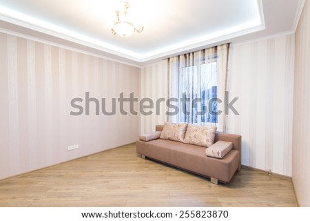 Sofa in the interior, a large spacious room.. Modern interior room with nice furniture inside