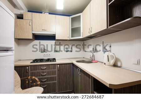 Small kitchenette in a studio, interior lighting