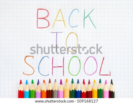 Colored pencils and back to school text