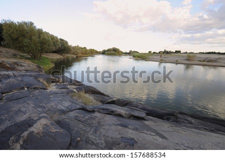 Orange River, Grobelarshoop, Northern Cape, South Africa.  It is the largest and longest river in South Africa. Rising in Lesotho where it is knows as the Senqu, it flows west to the Atlantic Ocean.