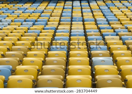 group of yellow and blue seat of stadium .