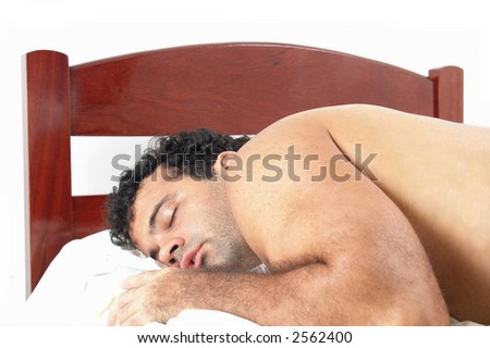 stock photo : Man sleeping like a bear in a single bed.