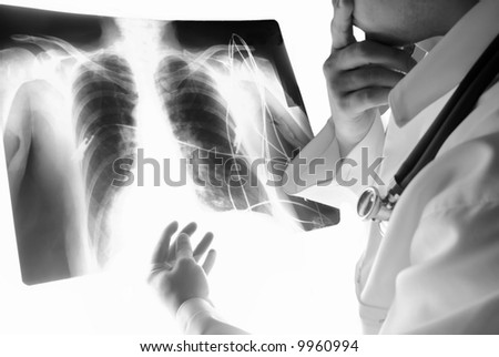 Adult Male Doctor Analyzing X-Ray . Black White