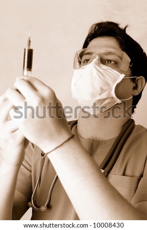 Doctor preparing the syringe to apply the injection.