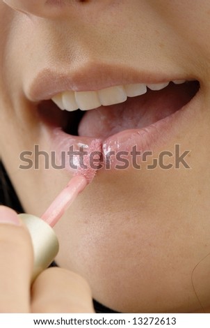 Close Up of a Woman lips making up .