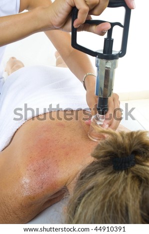 woman receiving an massage by Vacuum treatment method