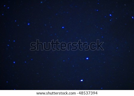 Image of stars in the sky at night .