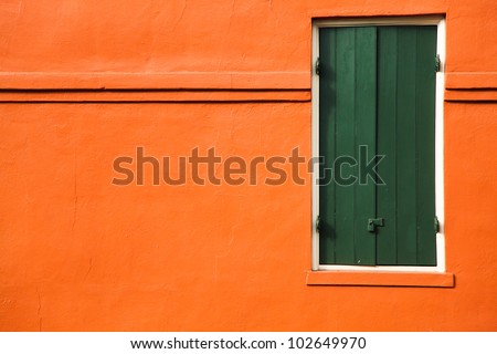 Green door and orange wall