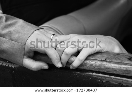 Bride and groom hands, back and white image