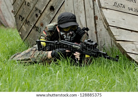 NIZHNY NOVGOROD, RUSSIA - MAY 13: Airsoft player fighting on may 13, 2012 in shooting ground near Nizhny Novrogorod, Russia. Airsoft is a recreational activity with replica firearms.