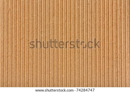 Clear yellow corrugated cardboard texture. Closeup. Horizontal