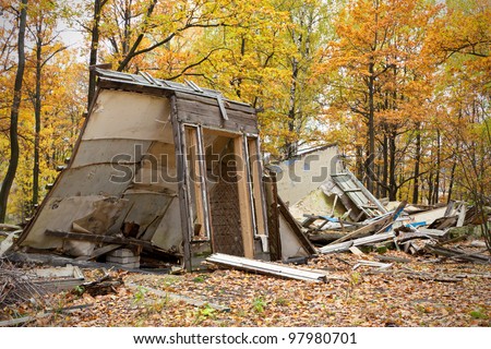 Abandoned and ruined cottage in the woods. Now it is only a fall.