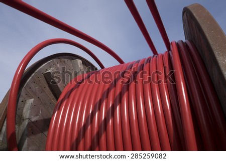 Wooden Coil of Red Electric Cable Outdoor