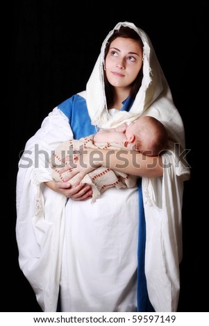 Mary looking to Heaven as she holds Jesus