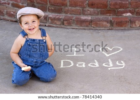 adorable smiling toddler writing \